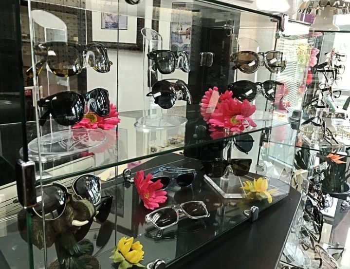 A glass display case of sunglasses at Affordable Family Vision Center.